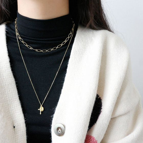 Modern Round Cross Necklace in Yellow Gold