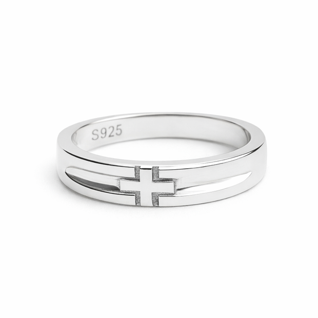 Silver ring with a cross design on a white background