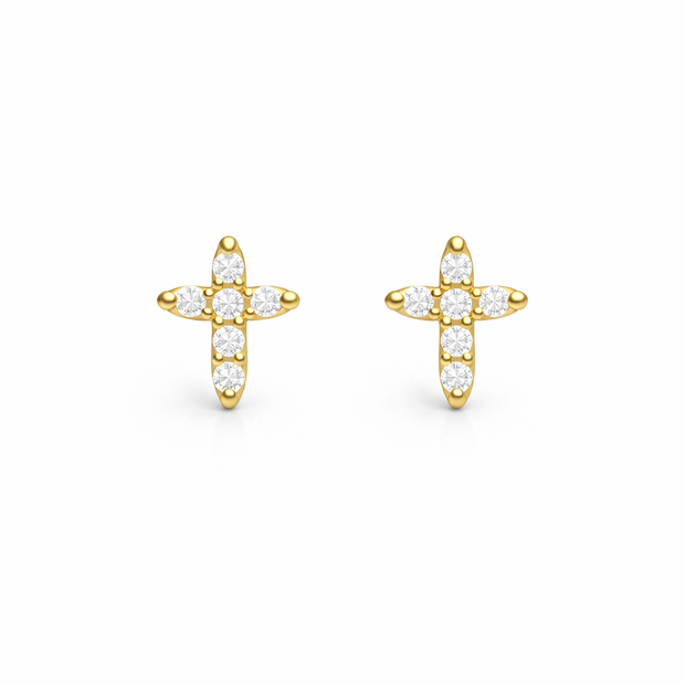 Gold cross-shaped earrings with clear stones on a white background